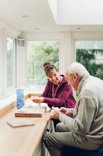 Home Instead Lichfield, Tamworth and North Warwickshire carer playing games with client