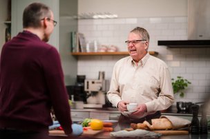 Home Instead Lichfield, Tamworth and North Warwickshire carer cooking with client