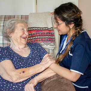 Apollo Care South Wirral - Carer and Client smiling at each other