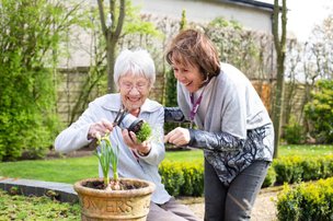 Home Instead Ruislip and Harrow carer gardening with client