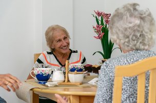 Manor Lodge in Harrow, resident and relative chatting