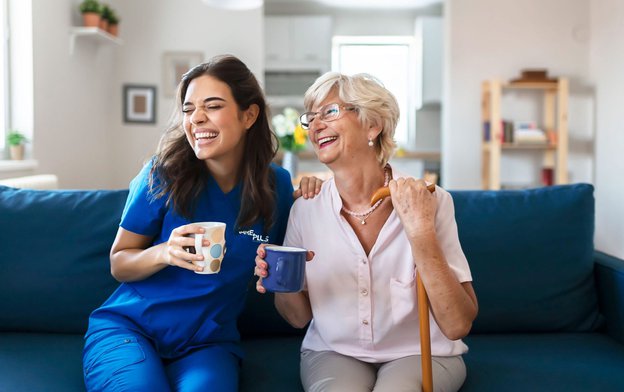 Kare Plus Kingston, Carer having tea with elderly