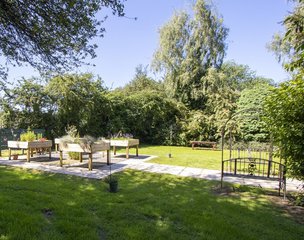 Llys Hafren Care Home - Large landscaped garden with raised flowerbeds