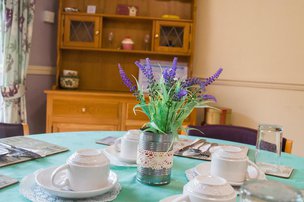 Netherton Green Care Home, dining area with flowers 