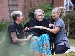 Oakwood House Care Home in Norwich carers sitting with client