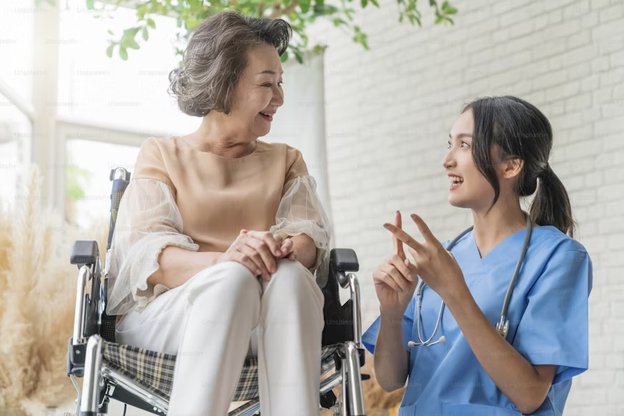 Lea Care in the Midlands carer sitting with client