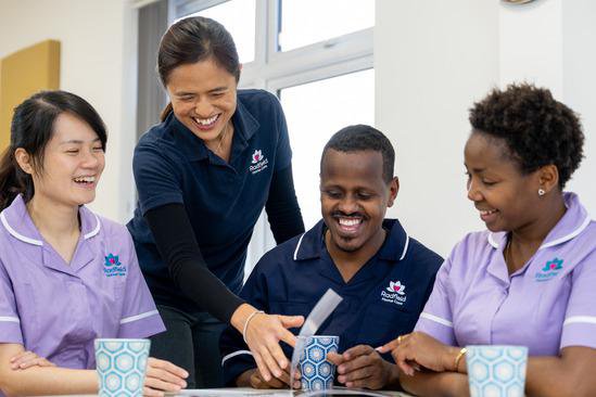 Radfield Home Care Wycombe, Beaconsfield & South Bucks, carers chatting together 