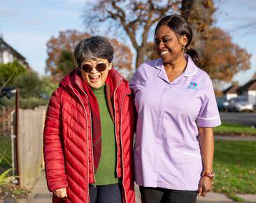 Radfield Home Care Wycombe, Beaconsfield & South Bucks, carer walking with client 