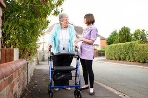 Radfield Home Care Bedford & Ampthill. Eldery lady with walking frame 