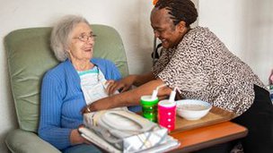Carer helping client