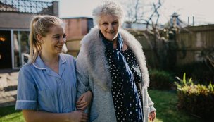 Waterloo Care Home - Carer walking with resident