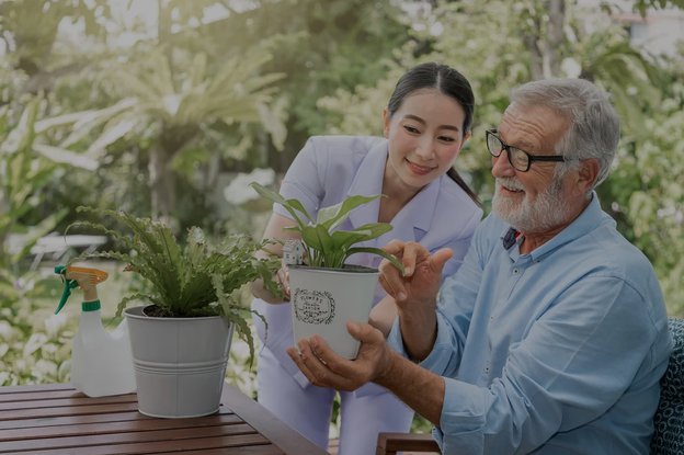 Royal Care Maidstone carer helping client with gardening