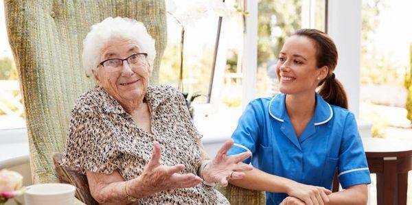 HS Home Care Limited carer having a chat with the elderly