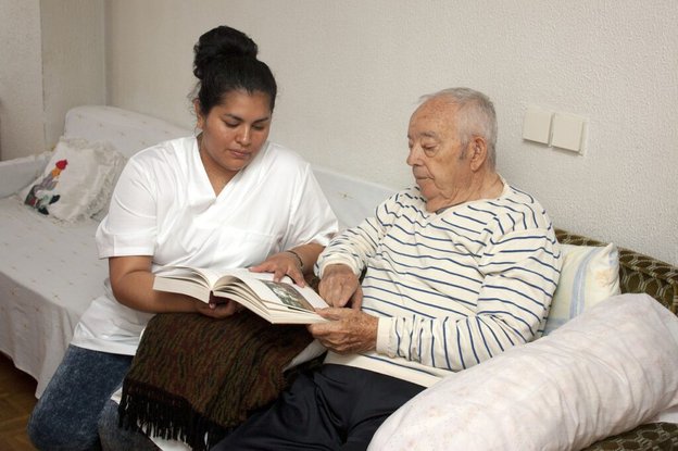 Sabbarn Care Solutions in Lancashire carer sitting with client