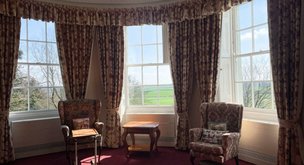 The Weir, Hereford, large window area with red curtains 