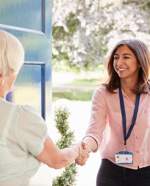 Clara Healthcare, Carer greeting client by the door