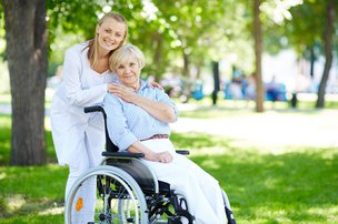 24/7 Exceptional Care Limited carer with elderly in the park