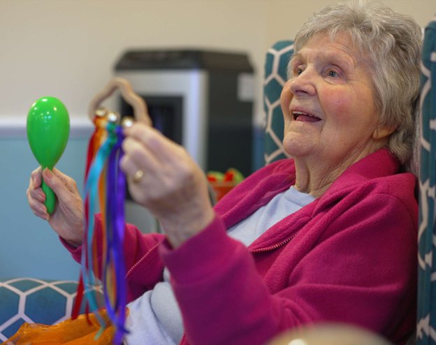 The Grove Care Home - resident participating in music session