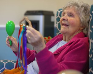 The Grove Care Home - resident participating in music session