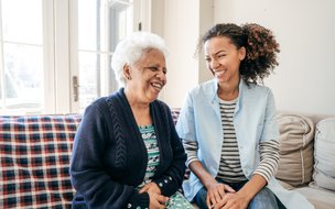 Siete Care, Banbury, carer sitting down with elderly lady 