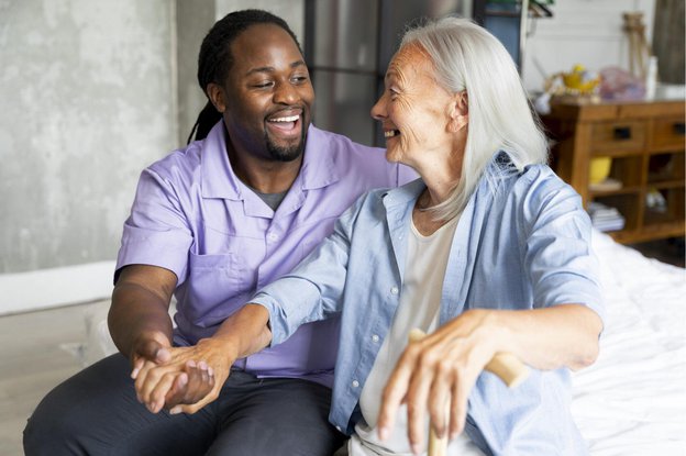Ultra Care Health Professionals, carer holding eldery ladys hand 