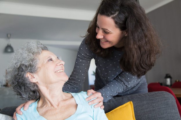 Southvale Care - carer smiling at elderly lady 