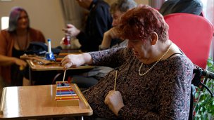 Springbank - resident taking part in music activity
