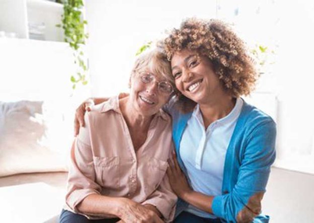 Springhill Care, carer hugging elderly lady 