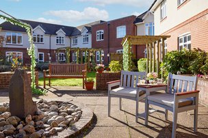 Stowford House Care Home rear exterior with garden patio