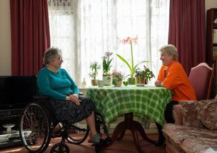 Sylvian Care South East London Carer having cup of tea with client