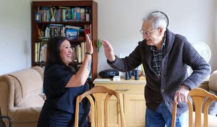 Sylvian Care South East London Carer high-fiving client