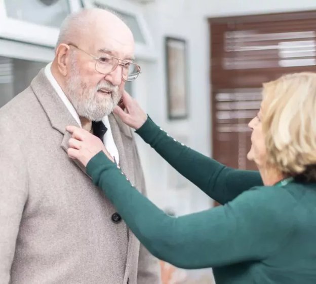 GoodOaks Homecare Glasgow South, adjusting elderly mans clothing 