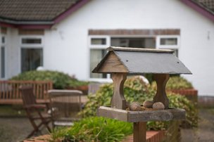 The Bungalow Care Home, Spalding. Bird house and garden area
