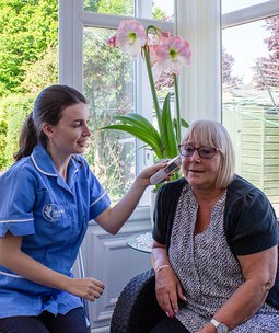 Bluebird Care Hounslow & Chiswick carer doing earings for client