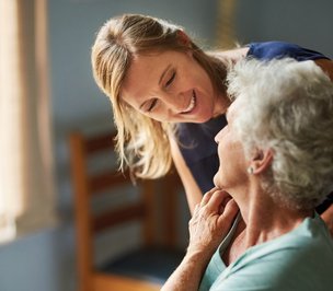 Visiting Angels Essex South West, Carer chatting with elderly 