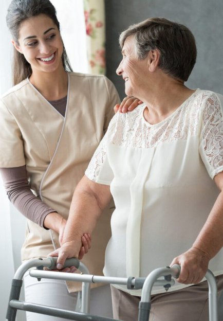 Verified Care and Support. Women helping elderly lady with frame. 