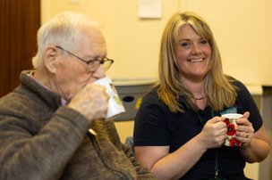 Walfinch Oxfordshire, carer having tea with client