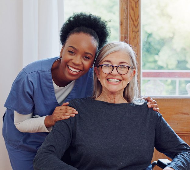 Ruby Care Services, Colchester,  carer smiling with lady 